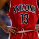 A detail shot of the tattoos of Chris Rodgers #13 of the Arizona Wildcats during the final moments of their loss to the UCLA Bruins in the semifinals of the 2006 Pacific Life Pac-10 Men’s Basketball Tournament on March 10, 2006 at Staples Center in Los Angeles, California. UCLA defeated Arizona 71-59.